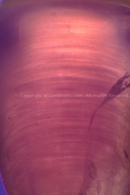Curved striae in Verneuil synthetic sapphire boule